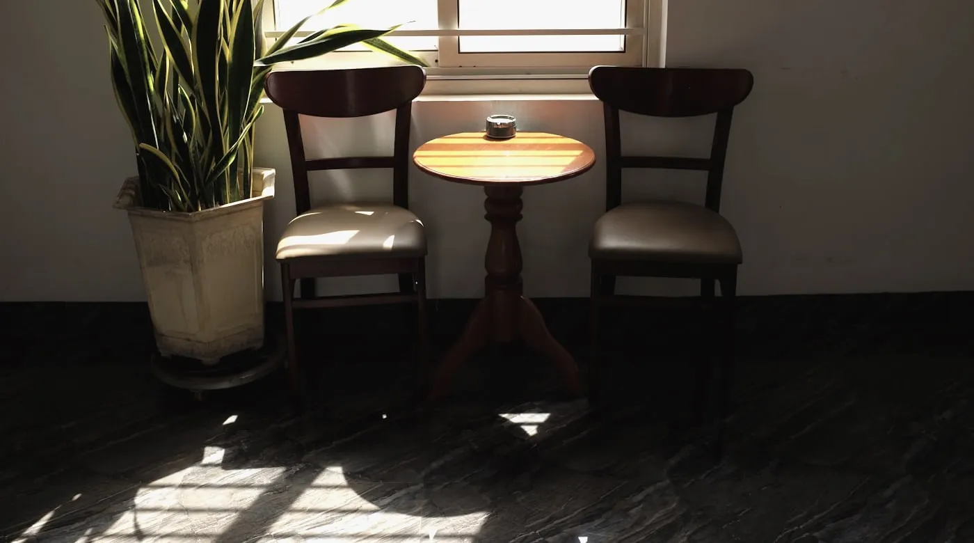The corner of the practice, with chairs beside a window onto Bengal Street.