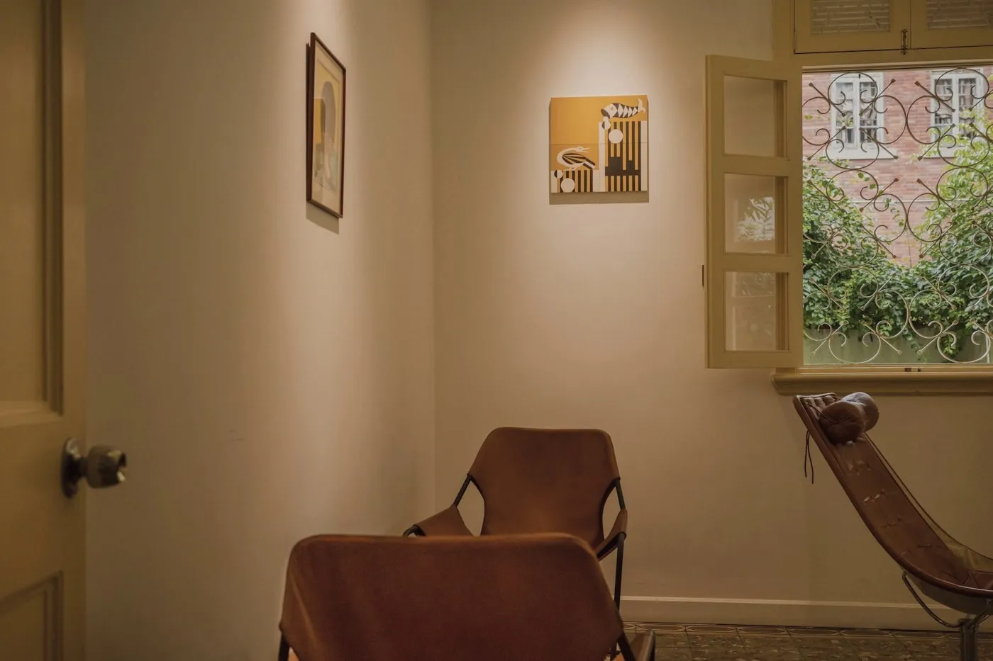 A quiet corner of the practice with two chairs beside a window.