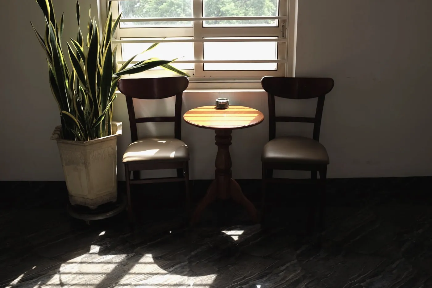 The waiting room, with chairs beside a window.